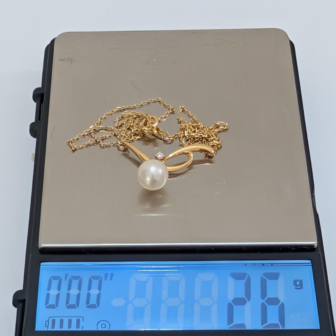Mikimoto pearl necklace featuring a 7.3mm pearl and diamond set in 18K yellow gold with 42cm chain