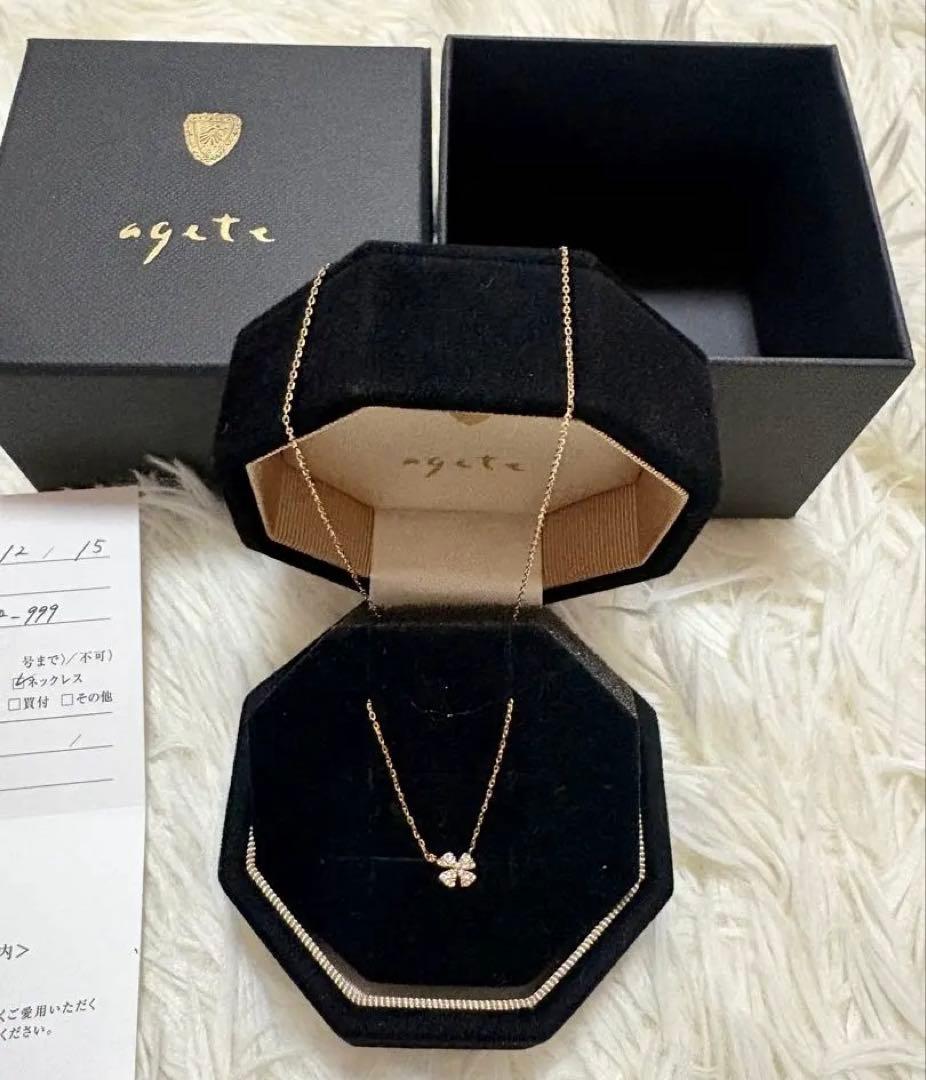 agete K10 gold tone diamond necklace with 0.05ct clover pendant displayed on white background