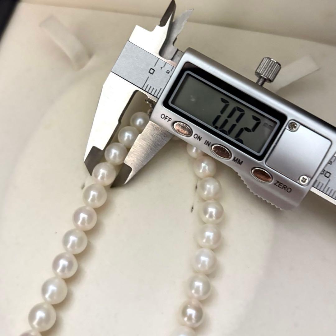 Long Akoya pearl necklace with two strands of round white pearls 7.5mm in size
