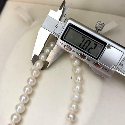 Long Akoya pearl necklace with two strands of round white pearls 7.5mm in size