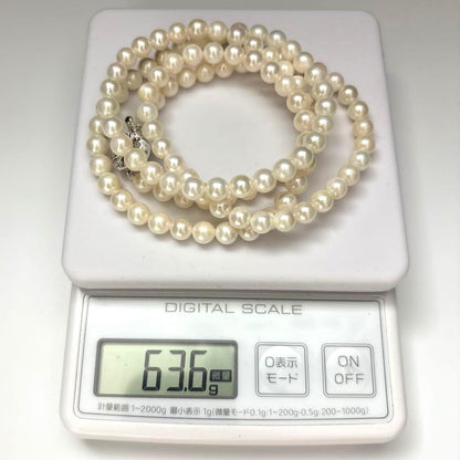 Long Akoya pearl necklace with two strands of round white pearls 7.5mm in size