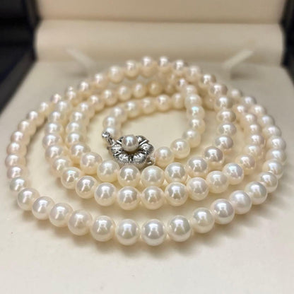 Long Akoya pearl necklace with two strands of round white pearls 7.5mm in size