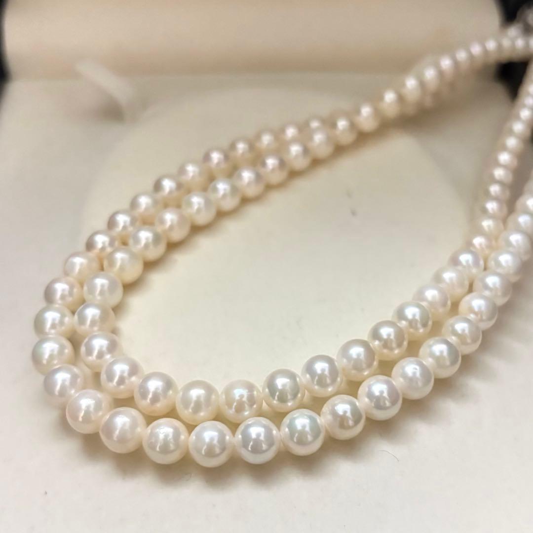Long Akoya pearl necklace with two strands of round white pearls 7.5mm in size