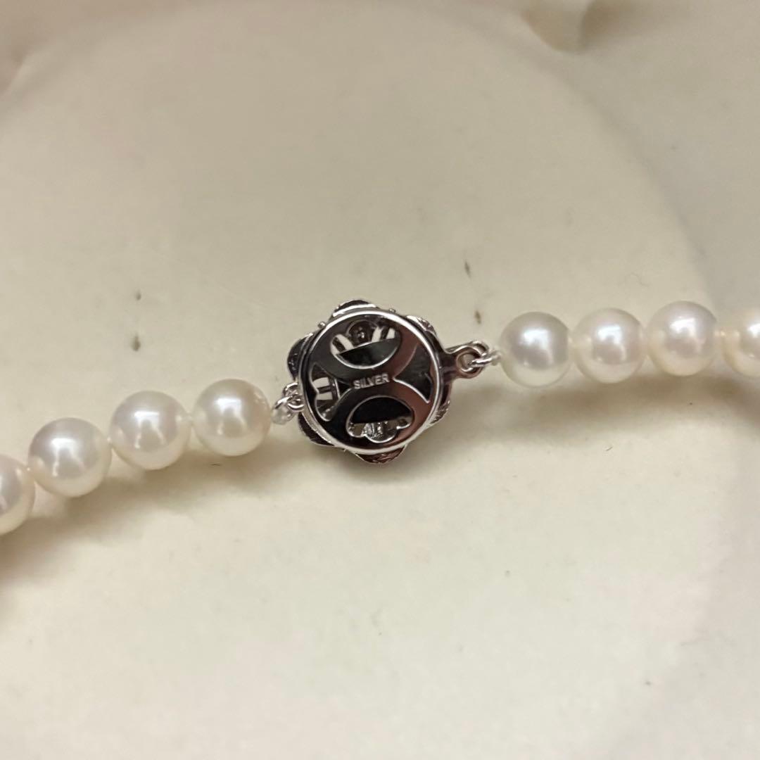 Long Akoya pearl necklace with two strands of round white pearls 7.5mm in size