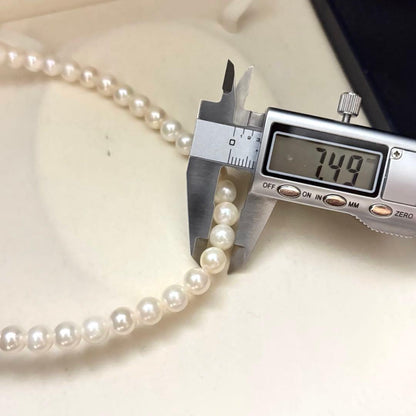 Long Akoya pearl necklace with two strands of round white pearls 7.5mm in size