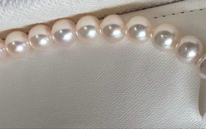 Akoya Flower Pearl Necklace with 7.5-8.0mm pink pearls, 43cm length, silver clasp, displayed on white background