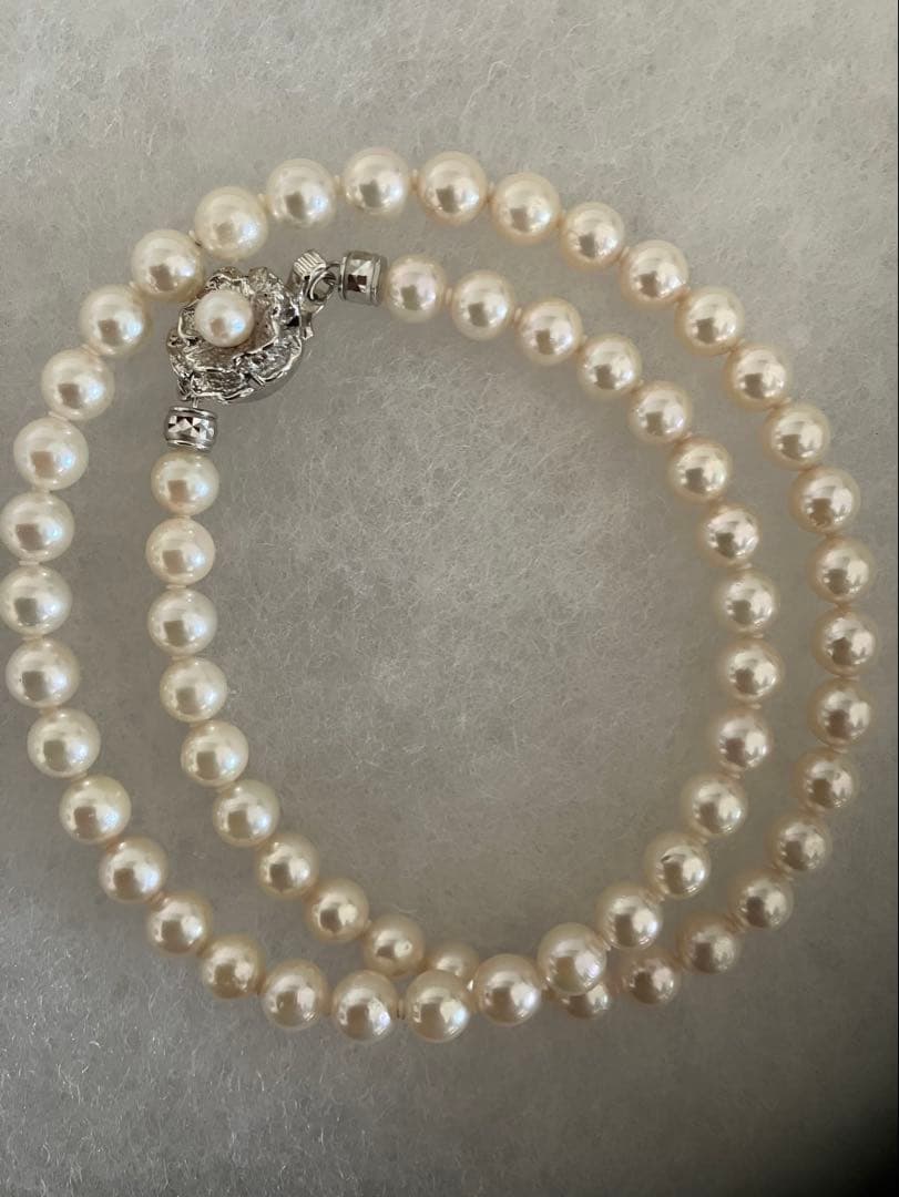 Akoya pearl necklace with 6.5-7mm white pearls, 45cm length, displayed on a white background