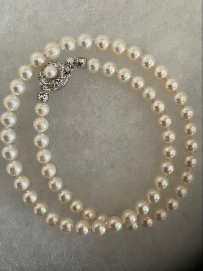 Akoya pearl necklace with 6.5-7mm white pearls, 45cm length, displayed on a white background