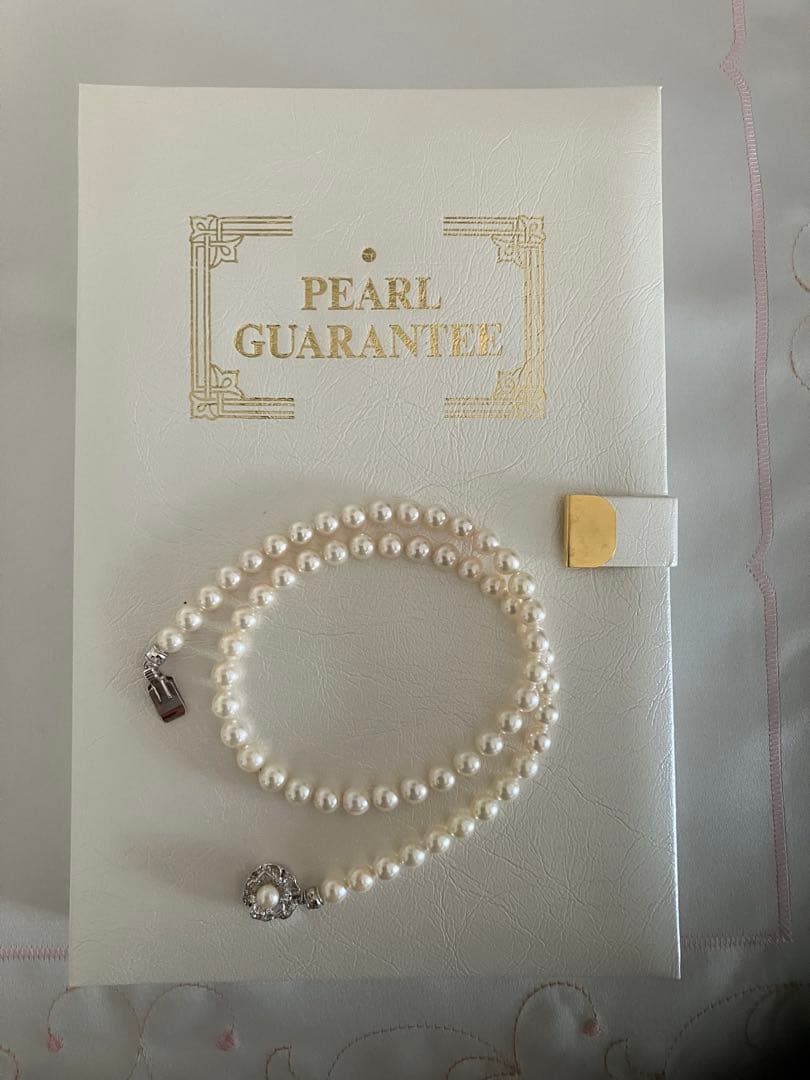 Akoya pearl necklace with 6.5-7mm white pearls, 45cm length, displayed on a white background
