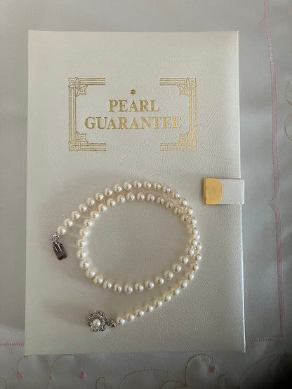 Akoya pearl necklace with 6.5-7mm white pearls, 45cm length, displayed on a white background