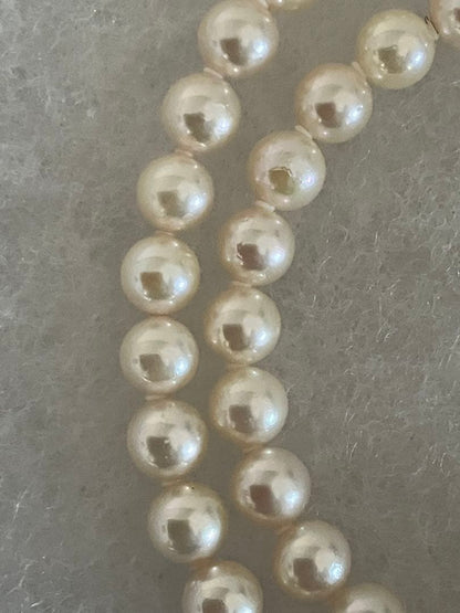 Akoya pearl necklace with 6.5-7mm white pearls, 45cm length, displayed on a white background