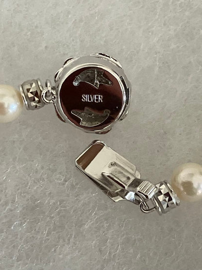 Akoya pearl necklace with 6.5-7mm white pearls, 45cm length, displayed on a white background