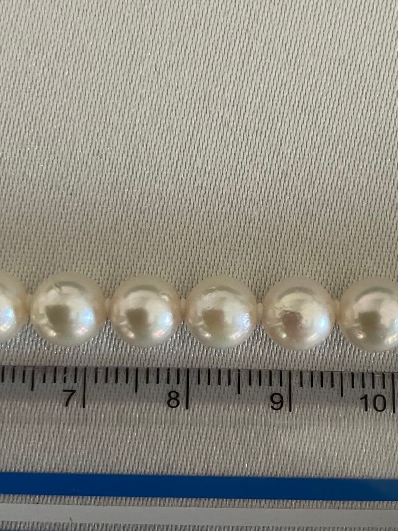 Akoya pearl necklace with 6.5-7mm white pearls, 45cm length, displayed on a white background