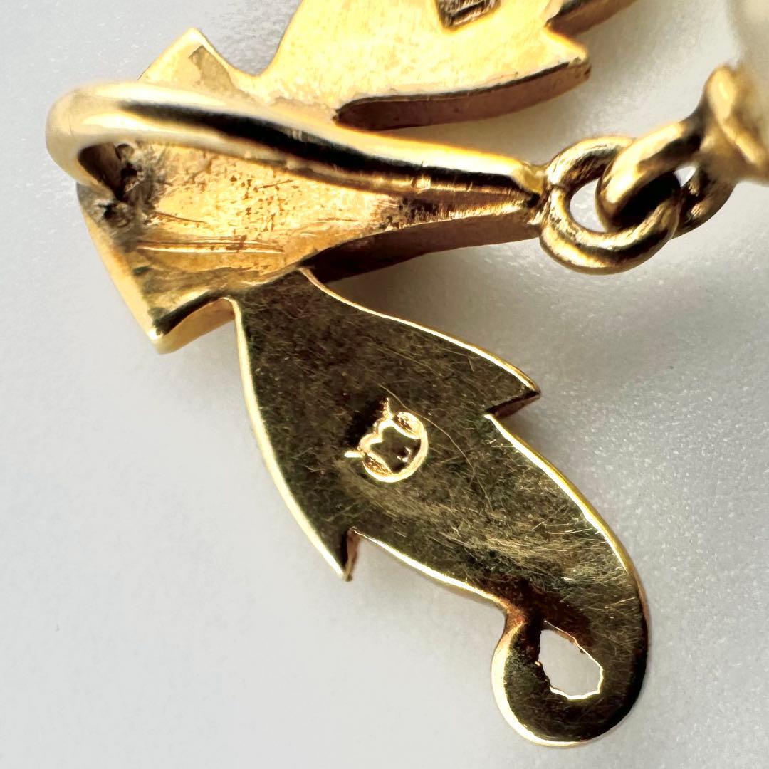 Mikimoto K14 pearl pendant featuring a blue-tinged 8-9mm pearl with a leaf motif in a vintage design