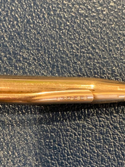 Kuro Cross Classic Century ballpoint pen with gold filled cap and barrel showing block letter logo