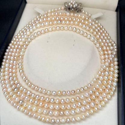 Long Akoya pearl necklace with 4-6mm white pearls measuring 198cm featuring multiple strands and silver marks