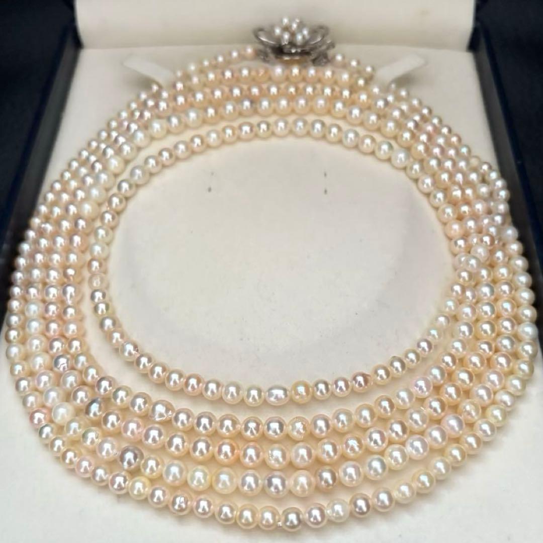 Long Akoya pearl necklace with 4-6mm white pearls measuring 198cm featuring multiple strands and silver marks