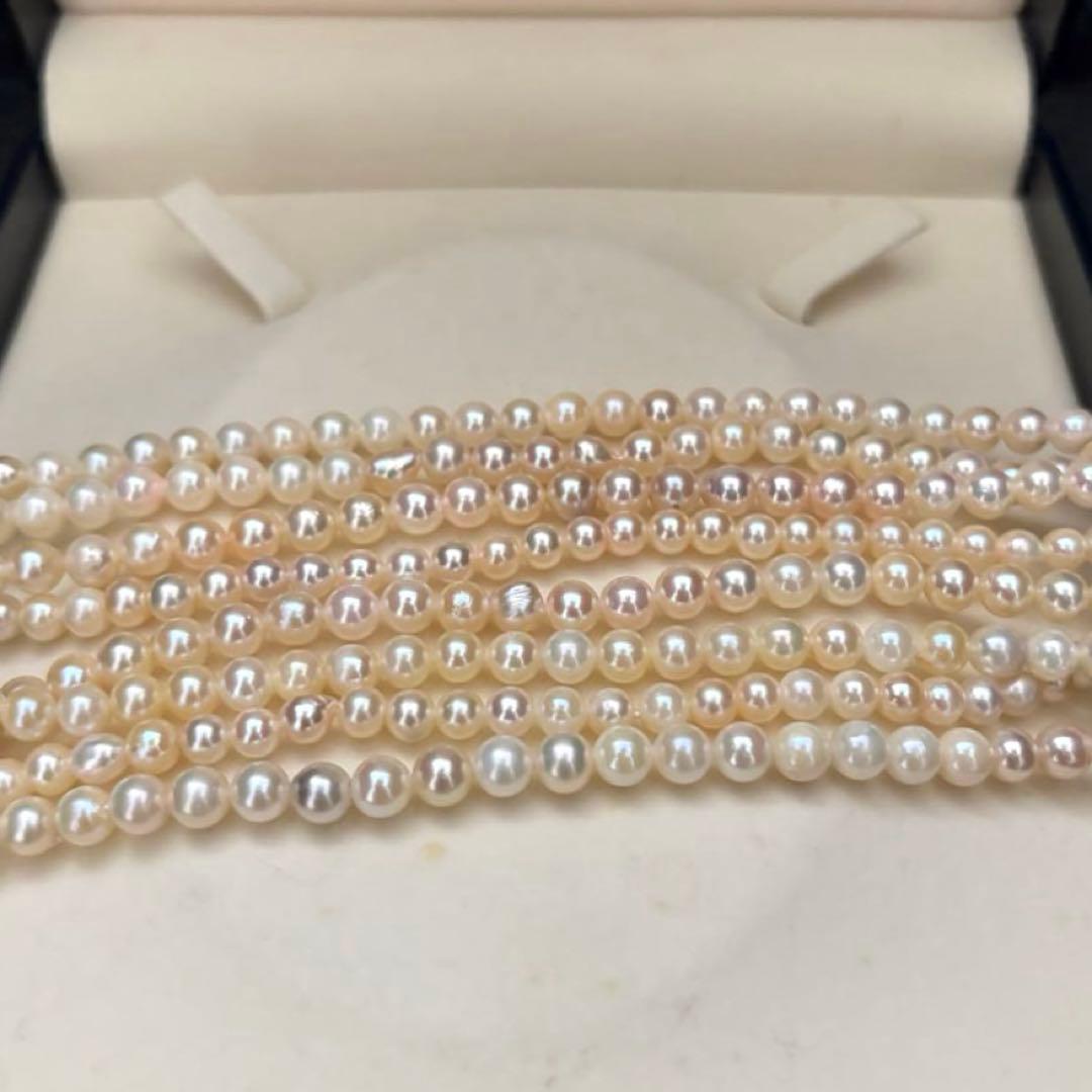 Long Akoya pearl necklace with 4-6mm white pearls measuring 198cm featuring multiple strands and silver marks