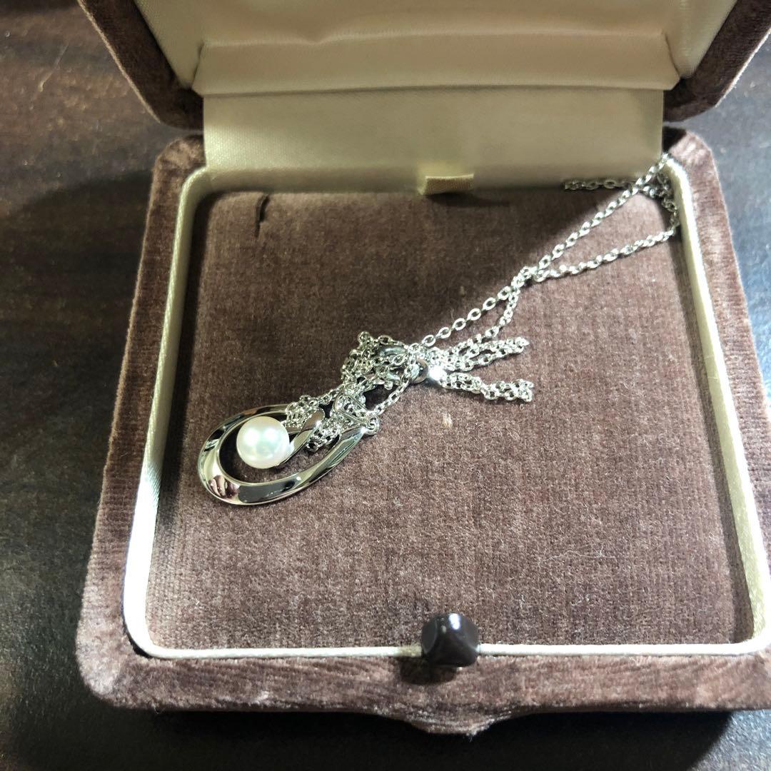 12330MIKIMOTO pearl necklace with 5.8mm pearls in silver displayed with dedicated case