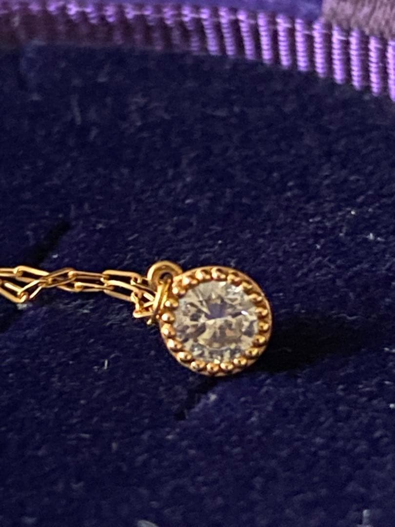 Agete K18 gold necklace featuring a 0.15-carat single diamond with milgrain detail on a 45cm slide chain