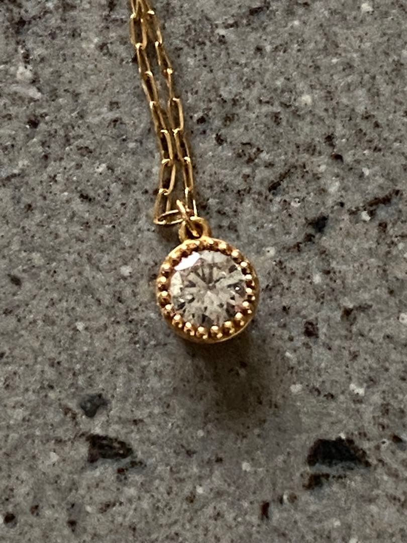 Agete K18 gold necklace featuring a 0.15-carat single diamond with milgrain detail on a 45cm slide chain