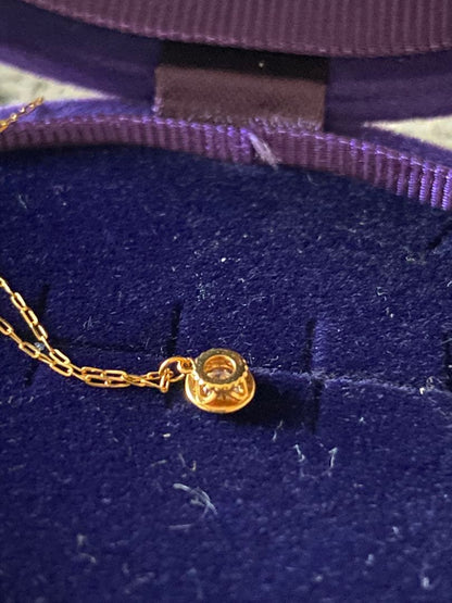 Agete K18 gold necklace featuring a 0.15-carat single diamond with milgrain detail on a 45cm slide chain
