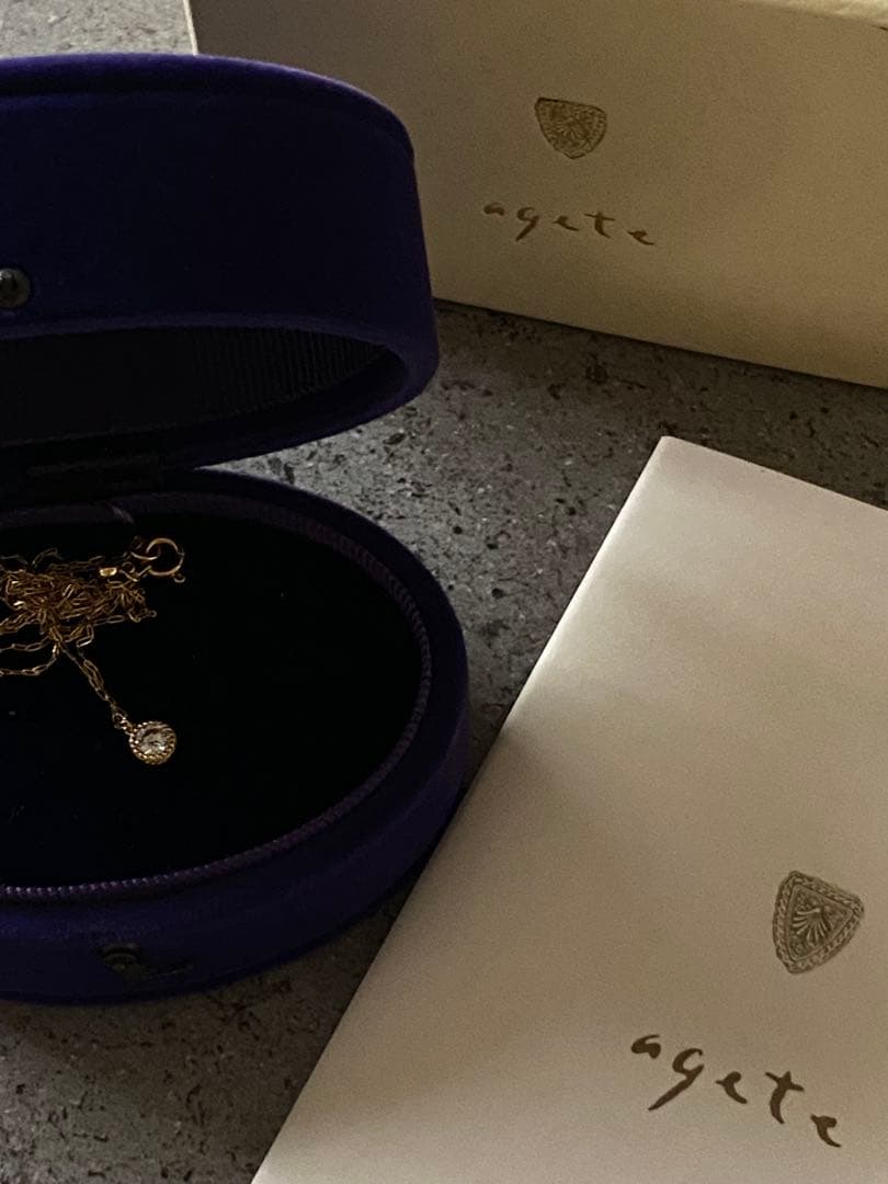 Agete K18 gold necklace featuring a 0.15-carat single diamond with milgrain detail on a 45cm slide chain