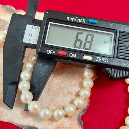 A33 Akoya pearl necklace with approximately 6mm genuine pearls on a 44cm cord