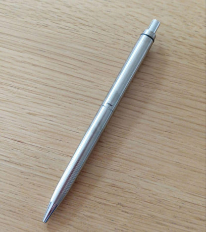 Pilot knock type ballpoint pen with silver metal shaft and black fine point ink