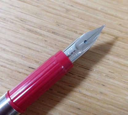 Pilot Birdie Mini Fountain Pen with silver and red body and fine nib displayed on white background