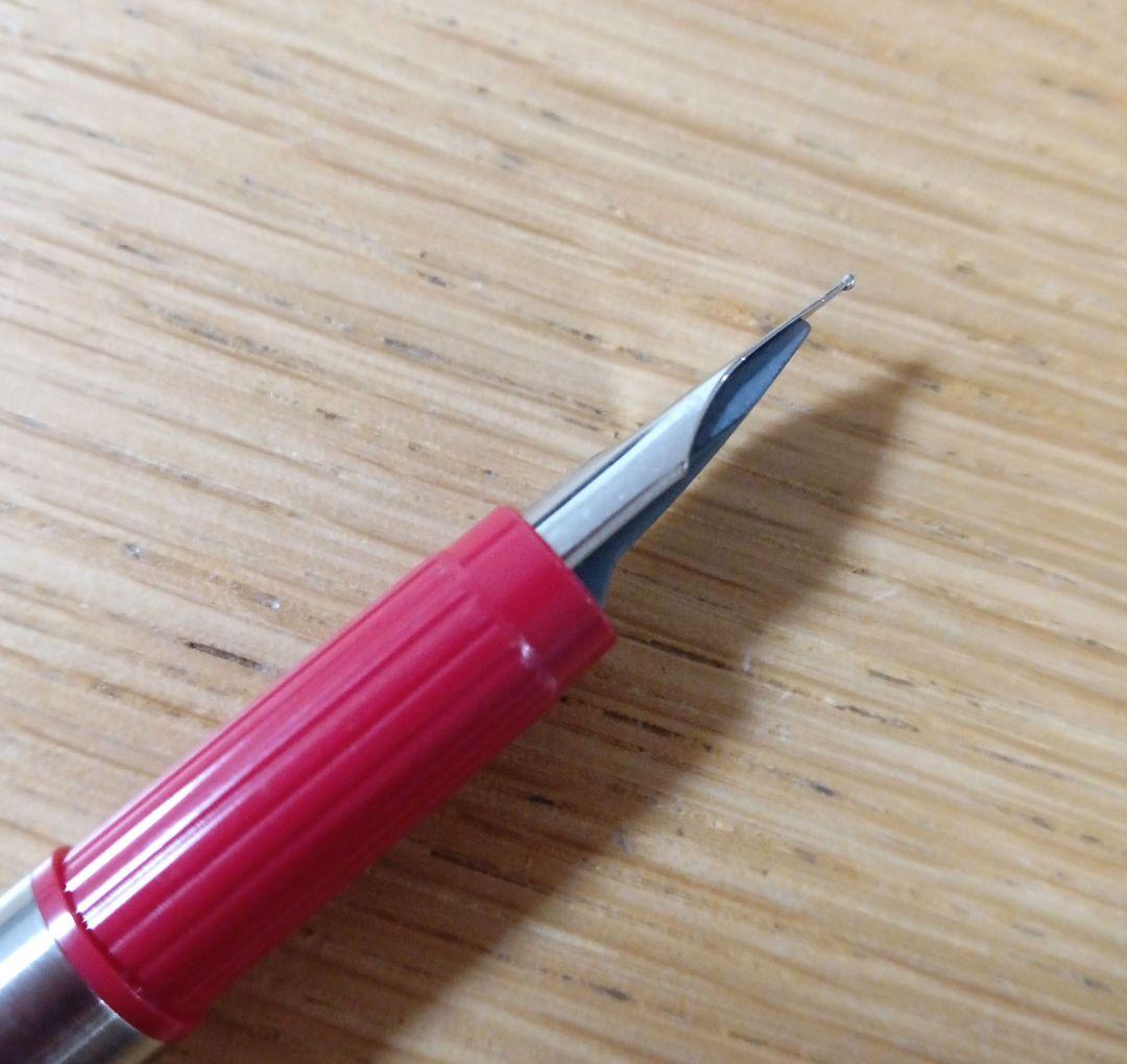 Pilot Birdie Mini Fountain Pen with silver and red body and fine nib displayed on white background