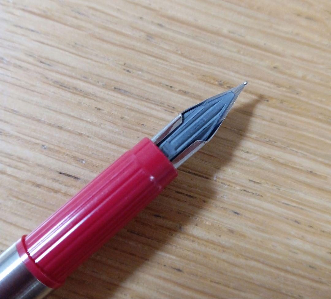 Pilot Birdie Mini Fountain Pen with silver and red body and fine nib displayed on white background