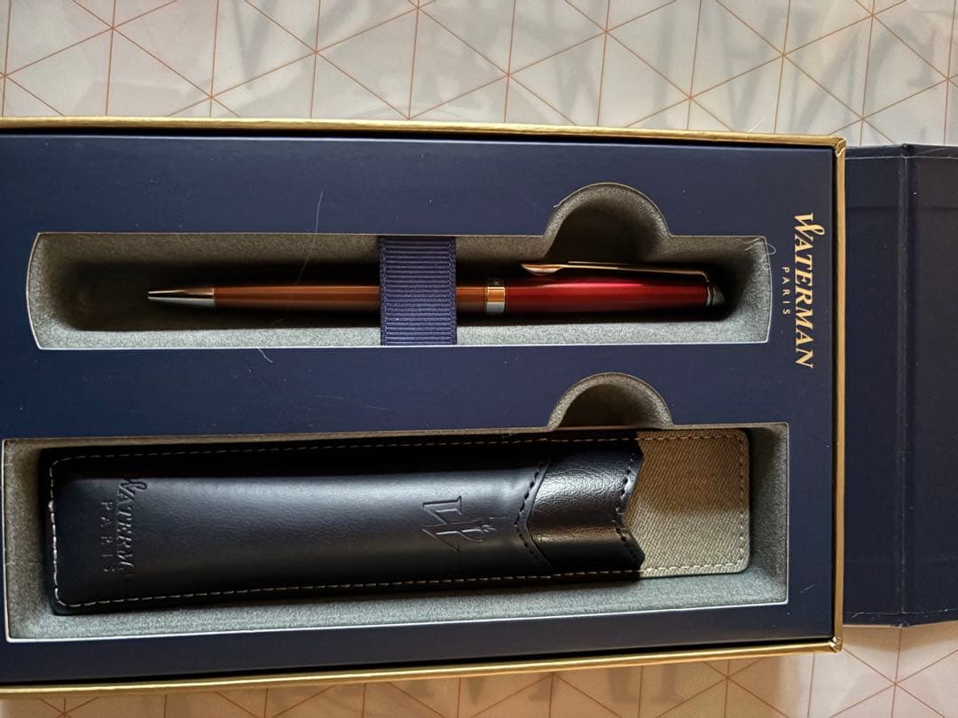 Waterman Metropolitan Essential Orange ballpoint pen in red-orange color with special and leather pen cases