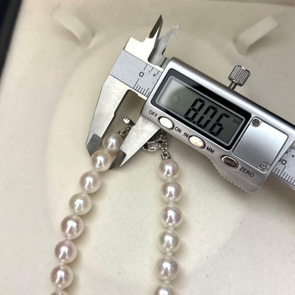 Akoya pearl necklace and matching earrings set with white 8mm pearls on a 43cm chain