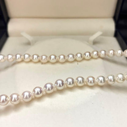 Akoya pearl necklace and matching earrings set with white 8mm pearls on a 43cm chain