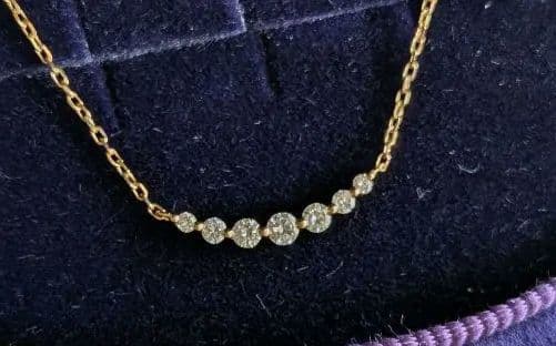 Agate K18 necklace featuring 0.1ct diamond with adjustable slide chain on white background