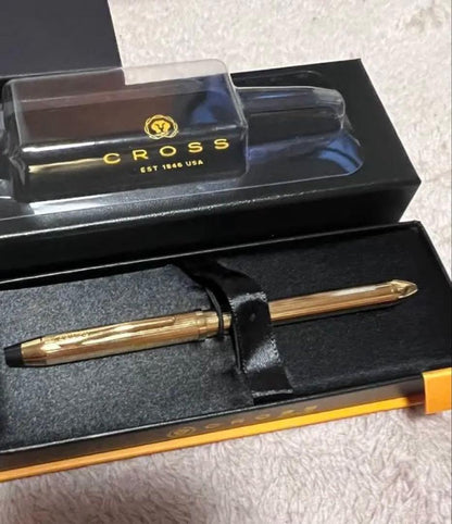 Cross ballpoint pen with gold tip and gold body, unused with name written, no box included