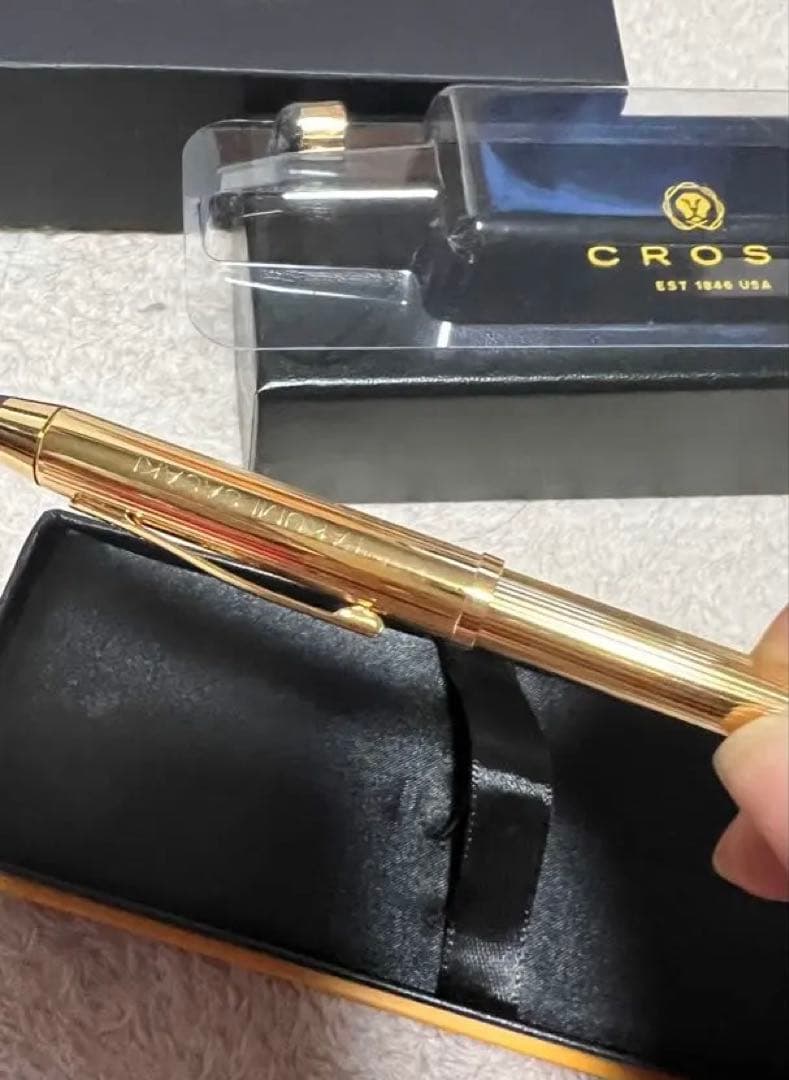 Cross ballpoint pen with gold tip and gold body, unused with name written, no box included
