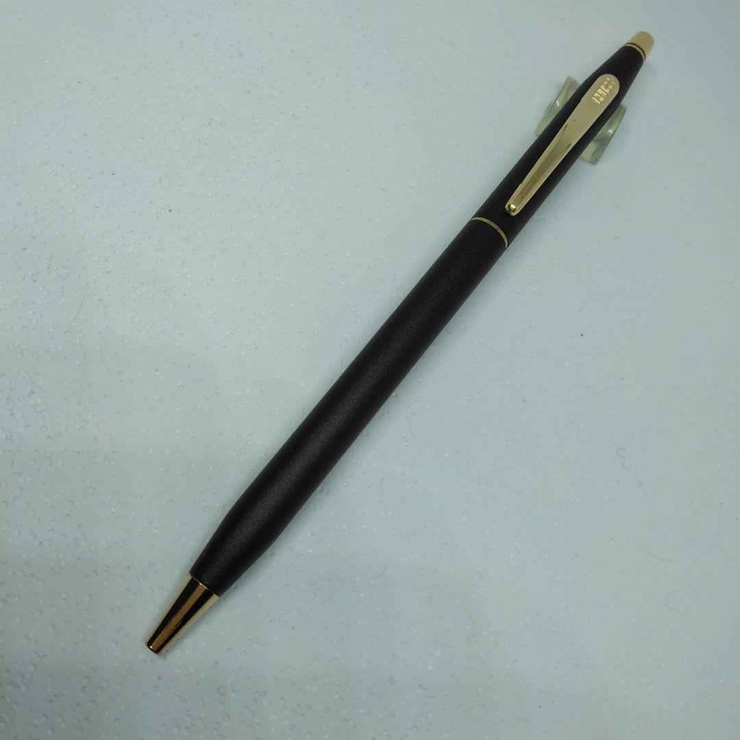 CROSS black ballpoint pen with gold accents displayed alongside its dedicated case