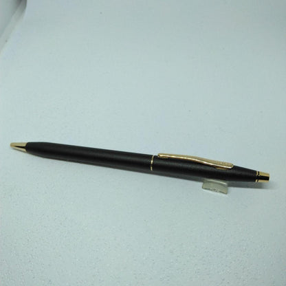 CROSS black ballpoint pen with gold accents displayed alongside its dedicated case