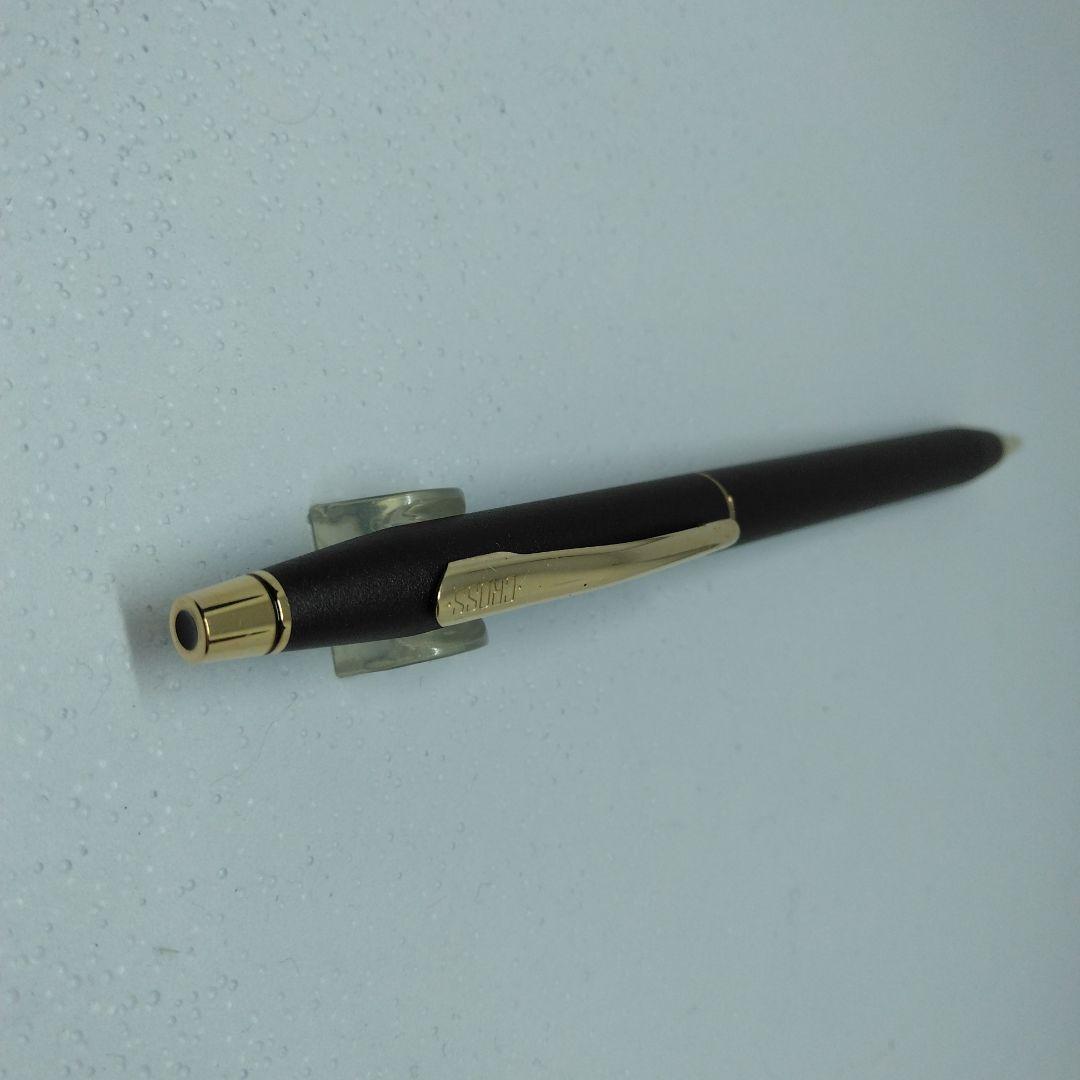 CROSS black ballpoint pen with gold accents displayed alongside its dedicated case