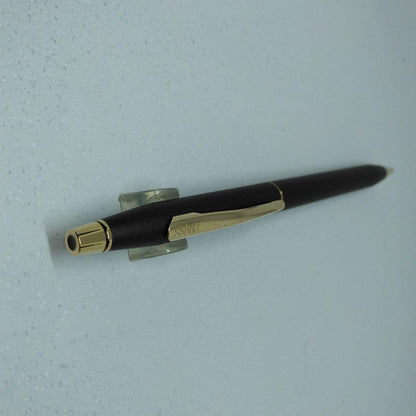 CROSS black ballpoint pen with gold accents displayed alongside its dedicated case