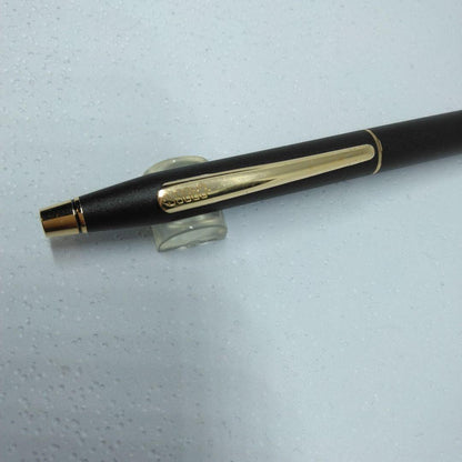 CROSS black ballpoint pen with gold accents displayed alongside its dedicated case