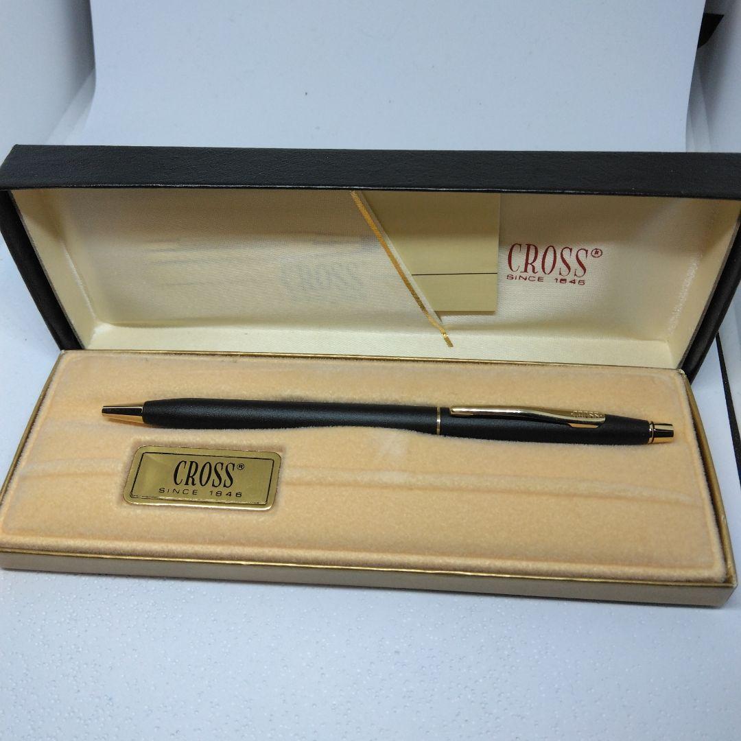 CROSS black ballpoint pen with gold accents displayed alongside its dedicated case