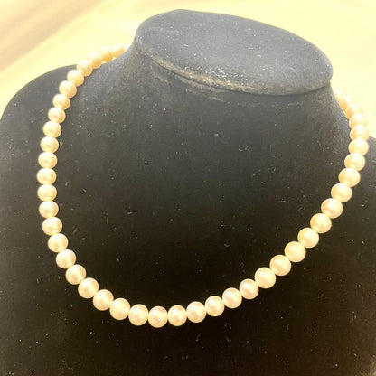 Akoya real pearl necklace with 7.0-7.5mm white pearls showing pink and green shades on a 44cm strand
