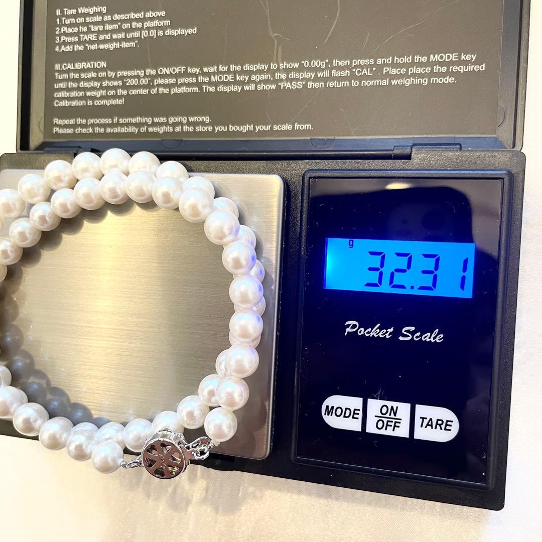 Akoya real pearl necklace with 7.0-7.5mm white pearls showing pink and green shades on a 44cm strand