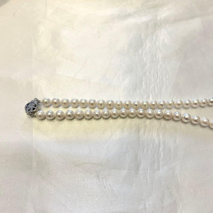 Akoya real pearl necklace with 7.0-7.5mm white pearls showing pink and green shades on a 44cm strand