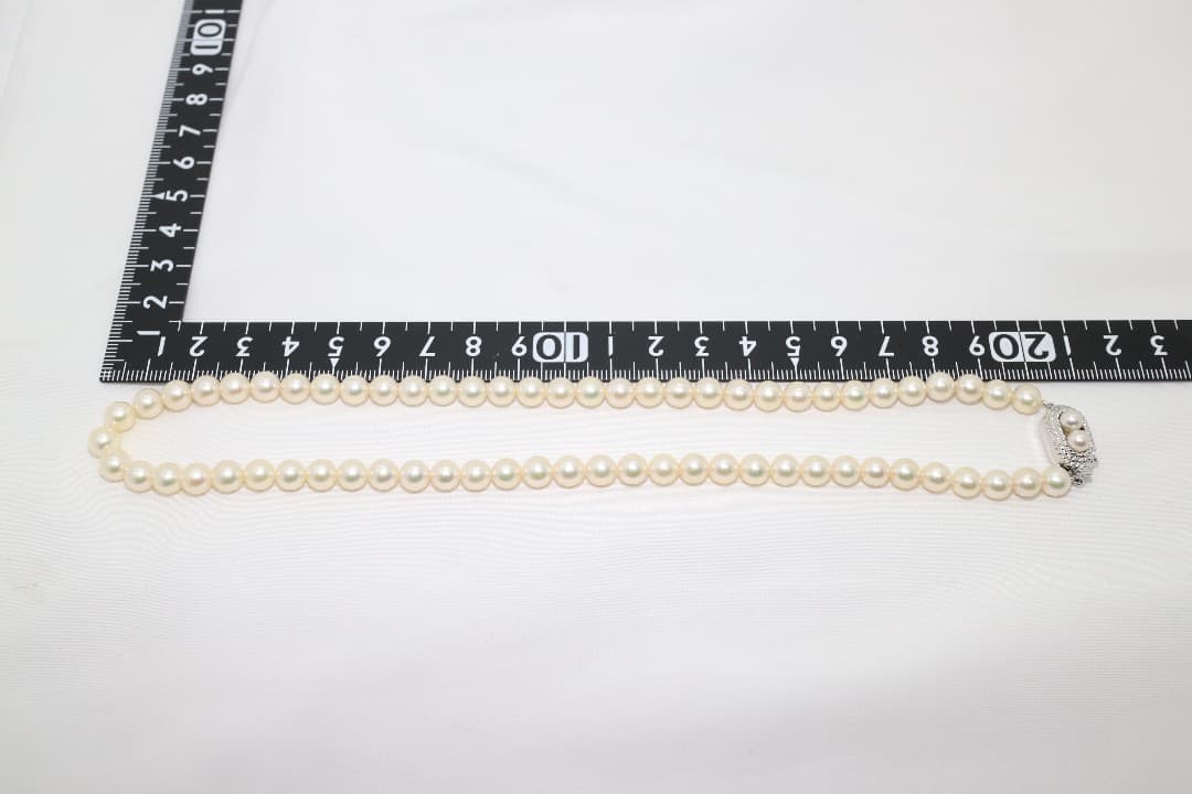Tasaki pearl necklace featuring genuine 6.2mm pearls with impressed markings on a 42.5cm strand