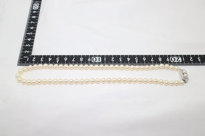 Tasaki pearl necklace featuring genuine 6.2mm pearls with impressed markings on a 42.5cm strand