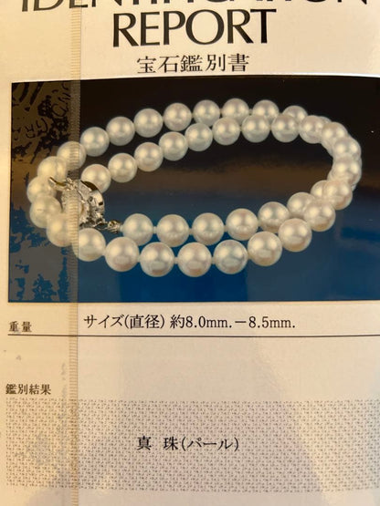 Akoya pearl necklace and matching earrings with silver clasp and certification sheet